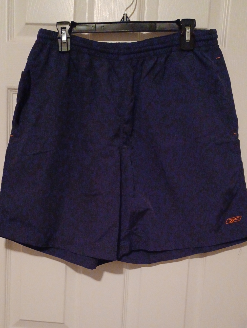 > Reebok Men's Deep Blue Swim Trunks with Orange Logo Accent